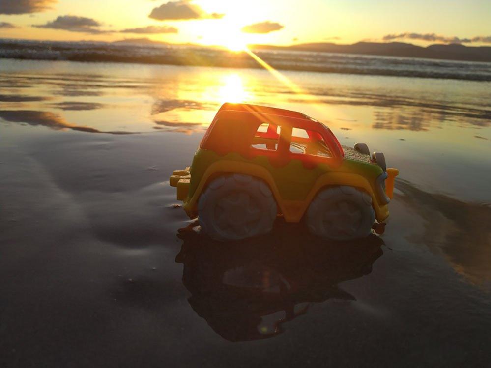 Toy car on a beach