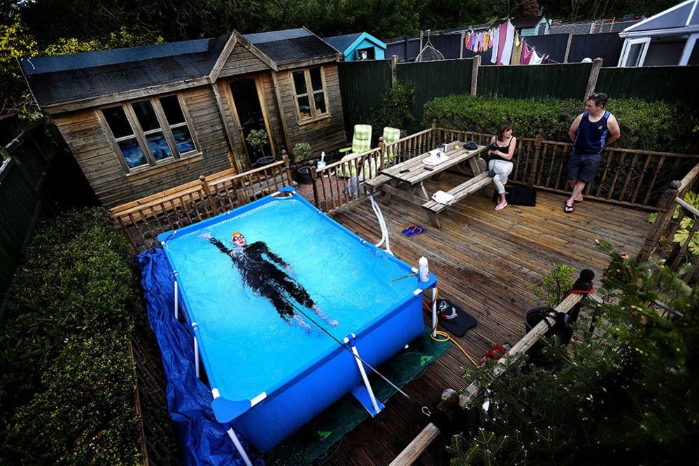 Triathlete Lloyd Bebbington trains in a pool in his garden at home