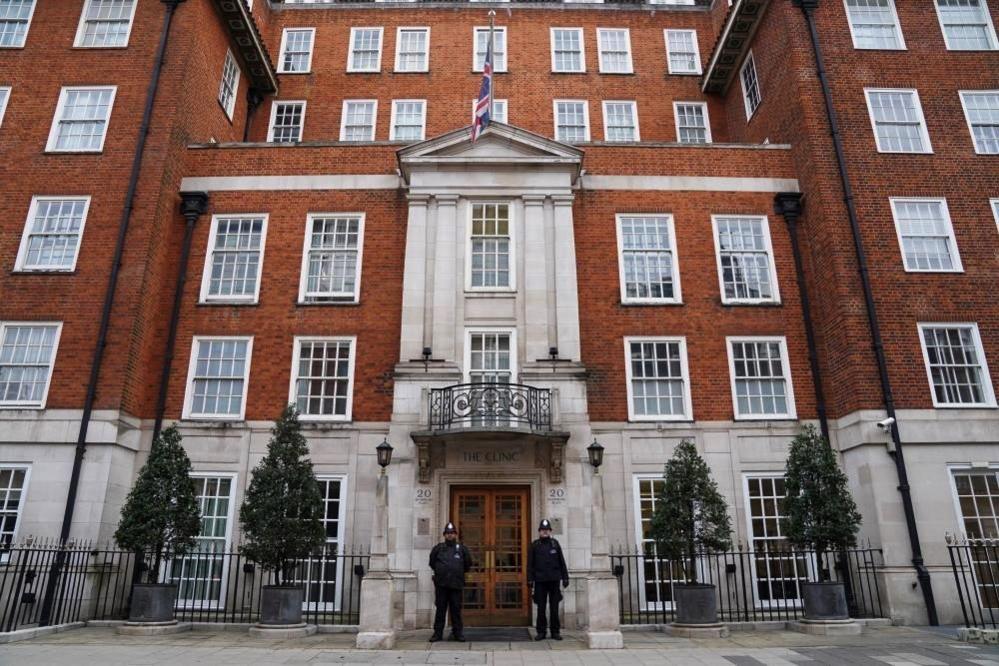 Police officers stand outside The London Clinic where Britain's King Charles is receiving treatment