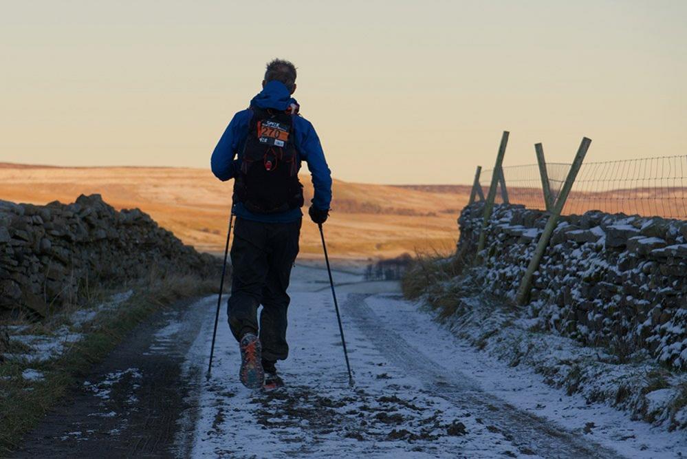 Man walking in snowy landscape