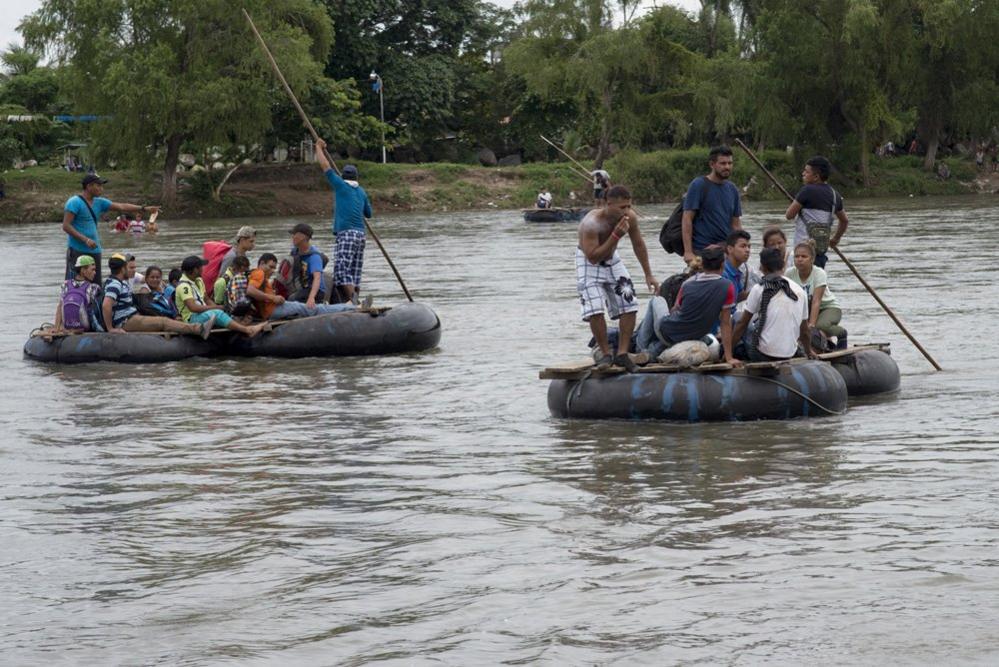 After waiting for more than 36 hours at the border bridge, some of the migrants crossed the border on rafts