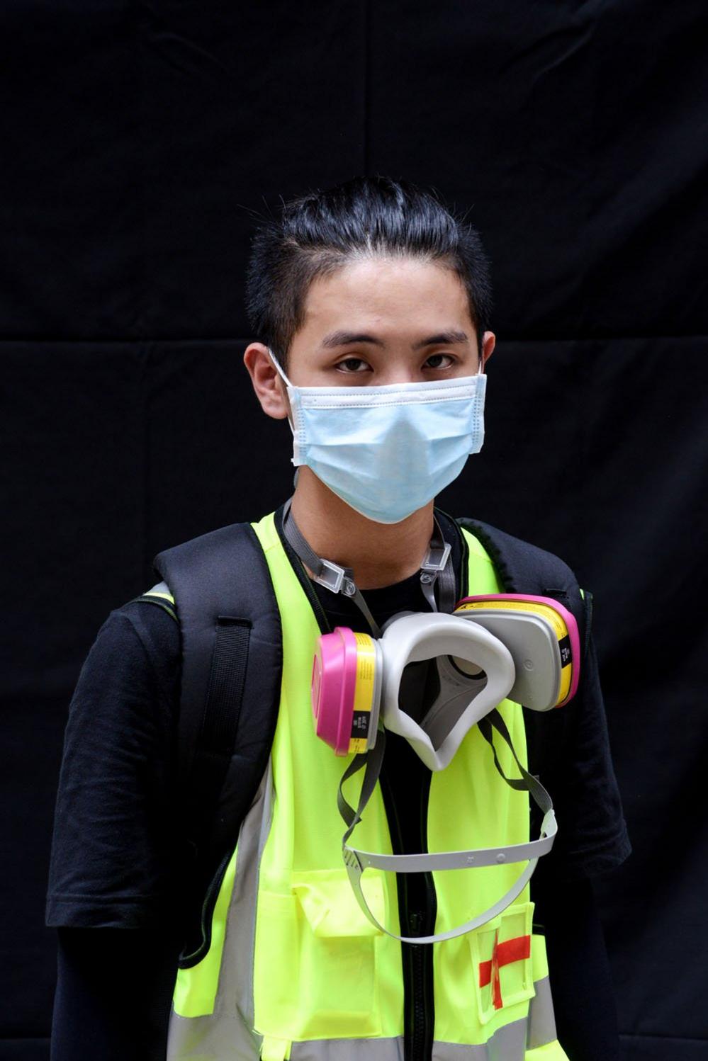 A protester poses for a portrait during the Anti-Totalitarianism march in Causeway Bay, Hong Kong, 29 September 2019