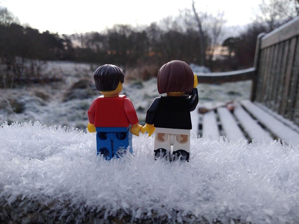 Two Lego figures in the snow