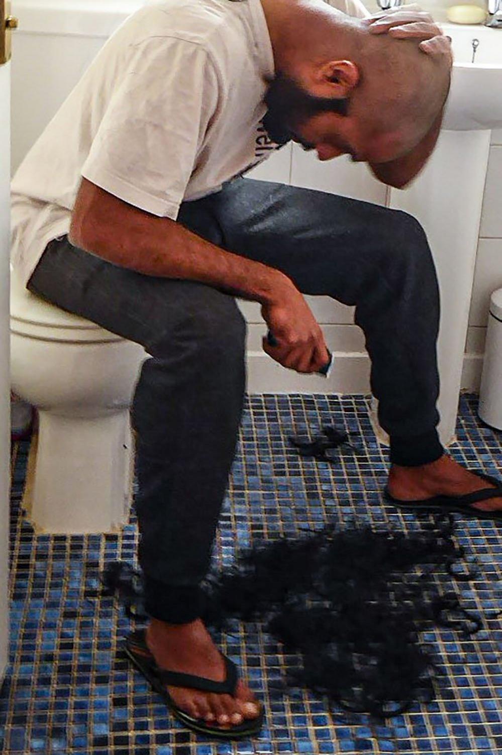 Man cutting his own hair