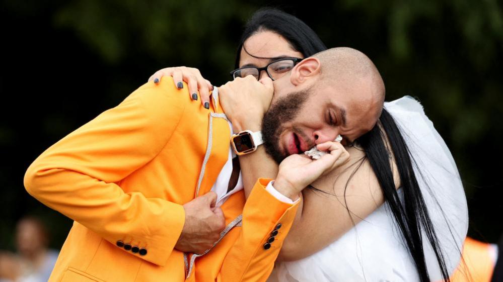 Otis Pena, friend of the former "Philadanco!" dancer O'Shae Sibley, who was stabbed to death in Brooklyn, reacts during his burial ceremony at Fernwood Cemetery in Lansdowne, Pennsylvania