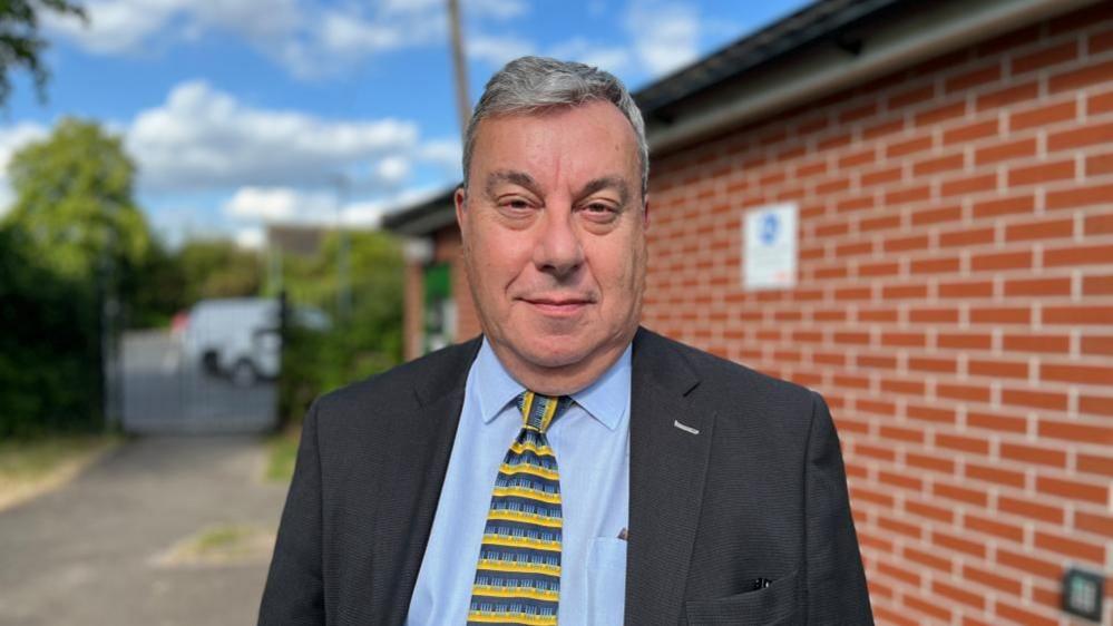 Councillor David Ellis, portfolio holder for Public Protection on Gedling Borough Council, stood in front of the toilet block.