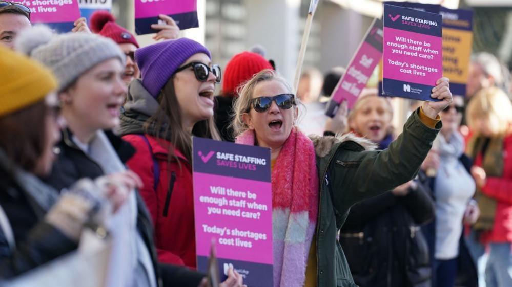 Workers on the picket line outside Royal Sussex County Hospital in Brighton during a strike by nurses and ambulance staff on 6 February 2023.