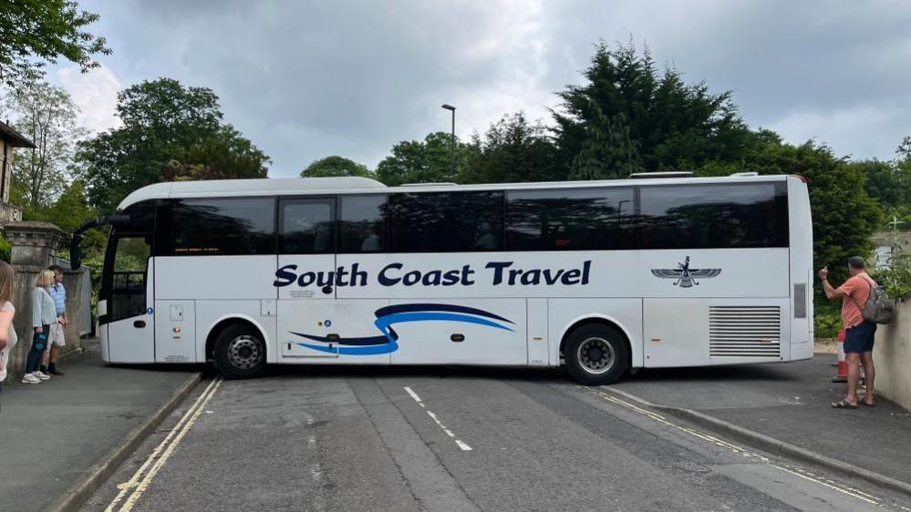 A coach struggles to turn around on Sydney Road in Bath 