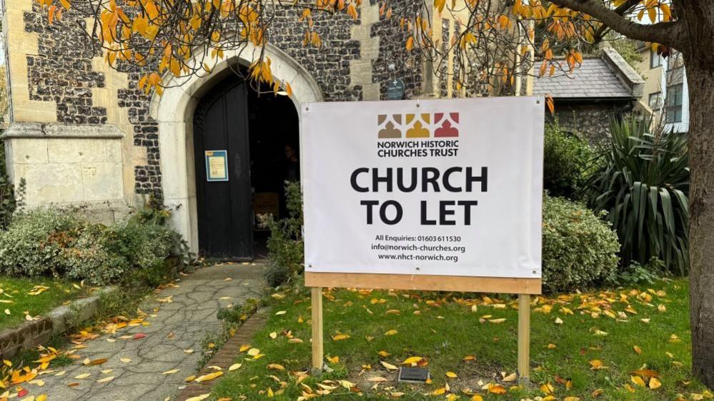 A sign outside St Saviour's Church, stating: "Norwich Historic Churches Trust; Church To Let" with details including phone: 016030 611530, email: info@norwich-churches.org and website: www.nhct-norwich.org