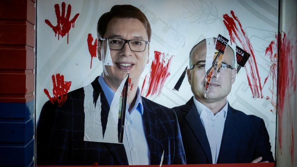 Pictures of Serbia's president and prime minister were daubed in red paint at their party offices in Novi Sad