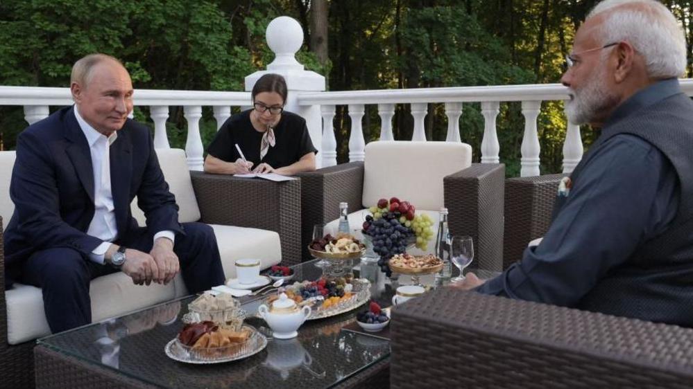 Russia's President Vladimir Putin welcomes Indian Prime Minister Narendra Modi for an informal meeting at the Novo-Ogaryovo state residence, outside Moscow, on July 8