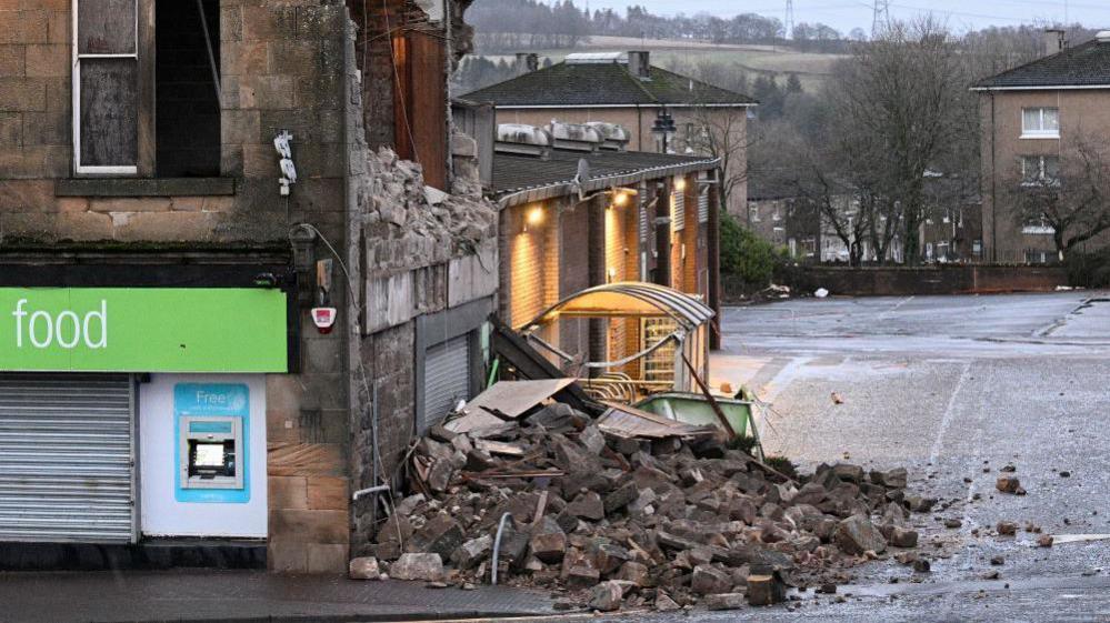 Rubble from a partially collapsed wall of a building is seen as Storm Eowyn hits, in Denny, Scotland, Britain, January 24, 2025.