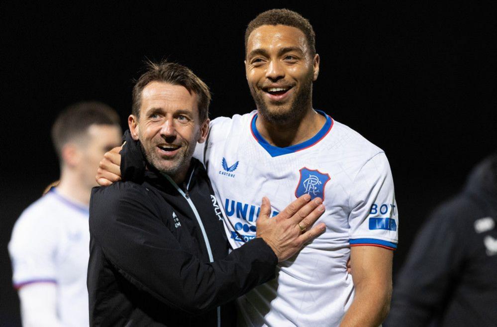 Cyriel Dessers with Neil McCann
