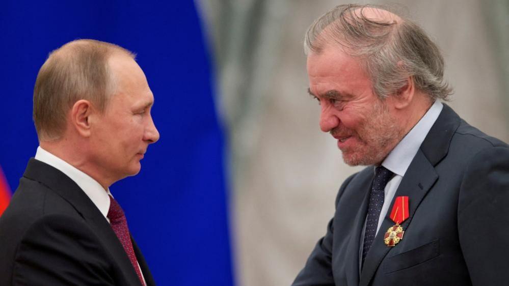 Russian President Vladimir Putin awards Mariinsky Theatre's artistic director Valery Gergiev during a ceremony at the Kremlin in Moscow, Russia, on 22 September 2016.