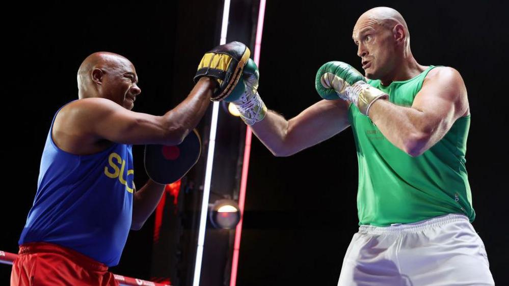 Tyson Fury working the pads during a training session with SugarHill Steward