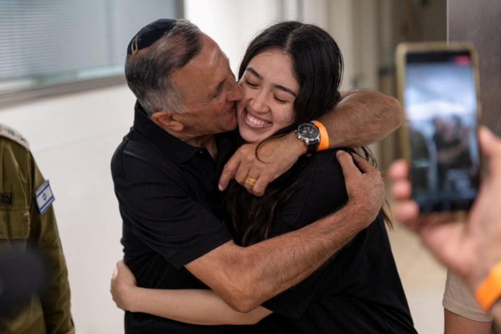 Noa Argamani, a rescued hostage embraces her father, Yakov Argamani