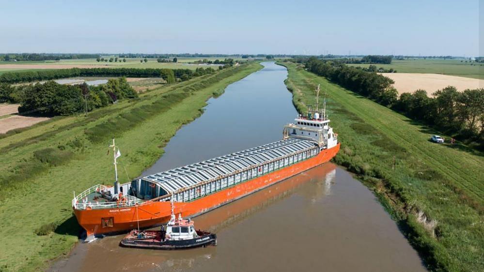 Cargo ship stuck in river