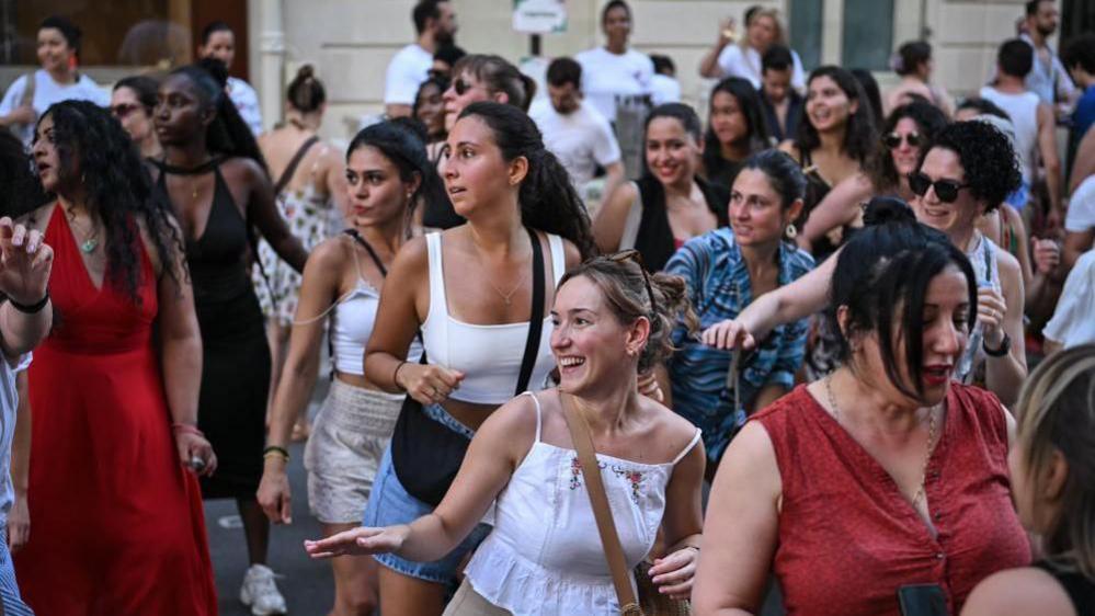 People dance during the fete de la musique in Paris