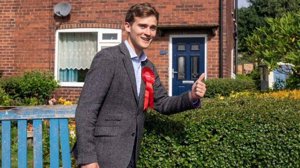 Keir Mather gives a thumbs-up on the campaign trail