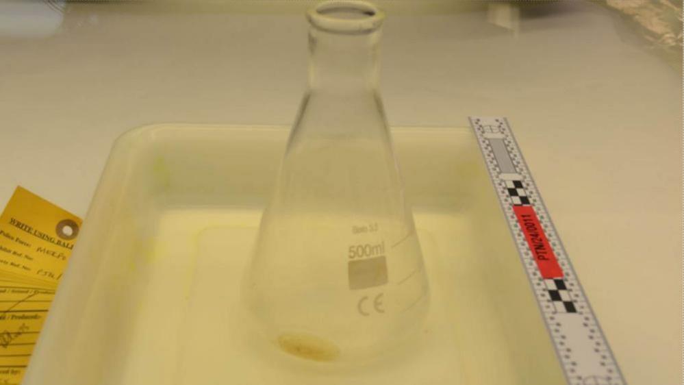 A picture taken of a laboratory flask as part of police evidence