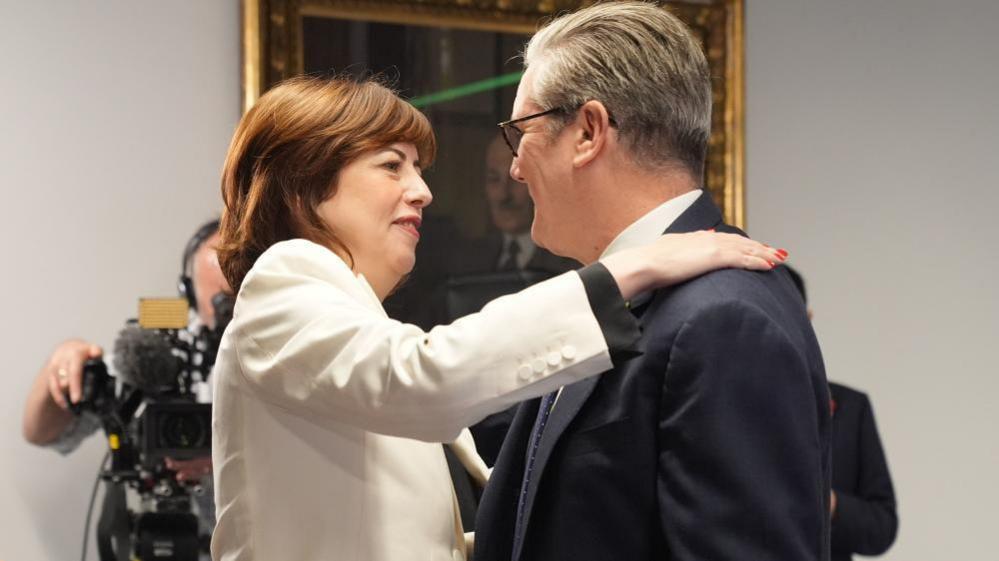 Lucy Powell hugging Sir Keir Starmer