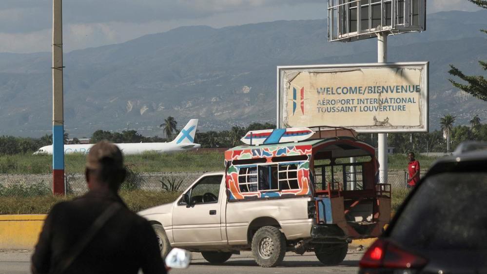 A person walks outside Toussaint Louverture International Airport after airlines suspended flights, in Port-au-Prince, Haiti October 25, 2024.