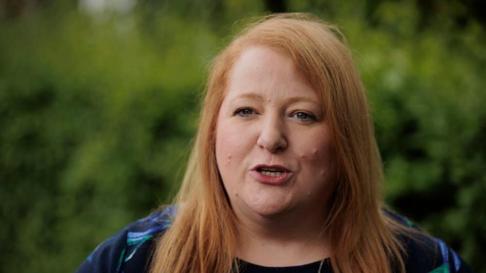 Naomi Long speaking to a camera 