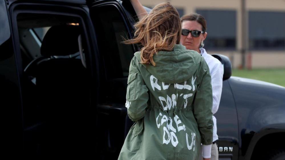 US First Lady Melania Trump walks from her to airplane to her motorcade wearing a Zara design jacket with the phrase (slogan) "I Really Don"t Care. Do U?" on the back as she returns to Washington, at Joint Base Andrews, Maryland on 21st June, after a visit to the Upbring New Hope Childrens Center, in McAllen, Texas