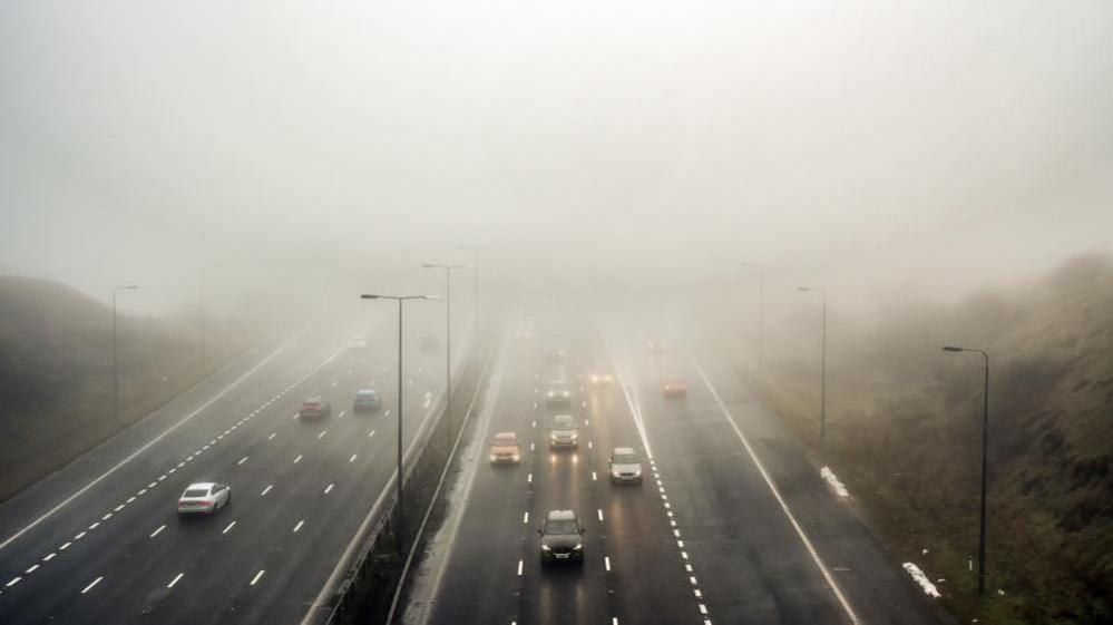 Foggy conditions on the M62 near Saddleworth Moor. The murky weather has shrouded much of the country over the past few days and shows little sign of abating yet. 