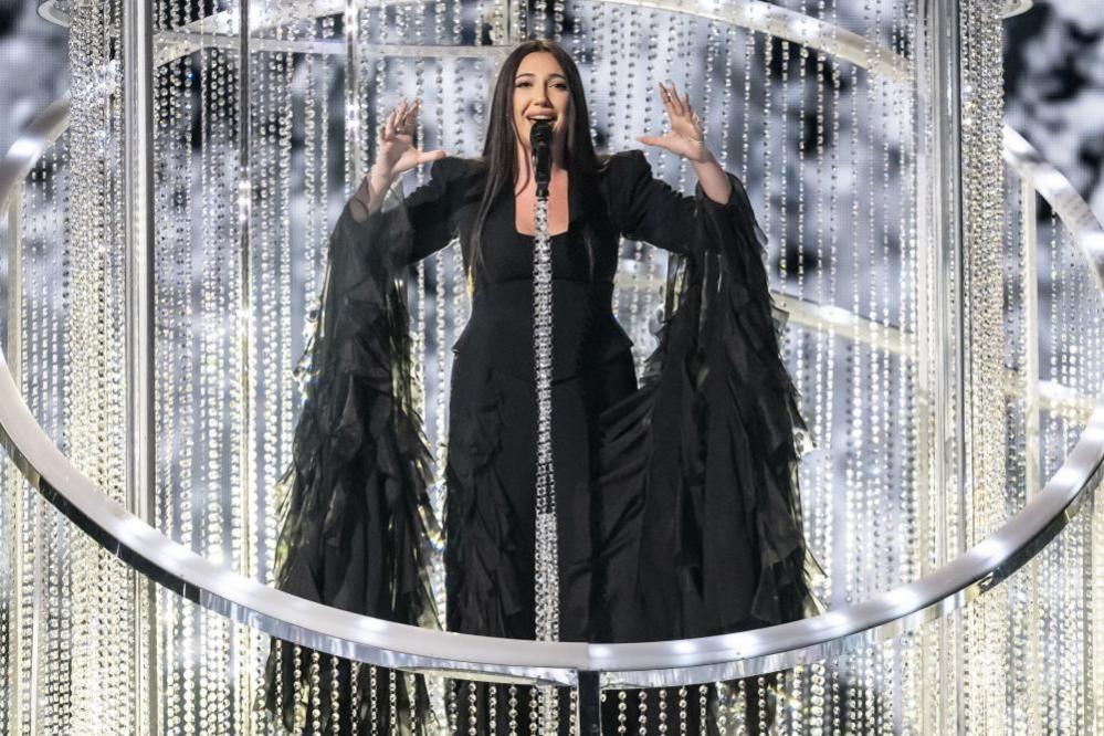Israel's entry Yuval Raphael performs during rehearsals in a black dress surrounded by a detailed sparkled stage prop.