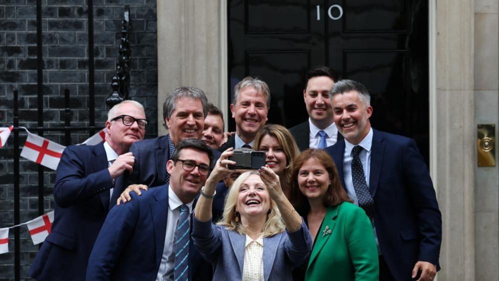 West Yorkshire Mayor Tracy Brabin takes a selfie with 9 other regional mayors, including Kim McGuinness and Ben Houchen, on the steps of 10 Downing Street. 