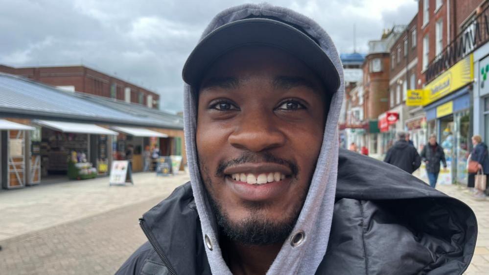 Bo Adekunle, standing in Great Yarmouth Market Place