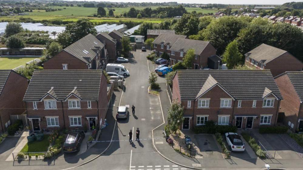 An aerial shot of police searching Axel Rudakubana's home