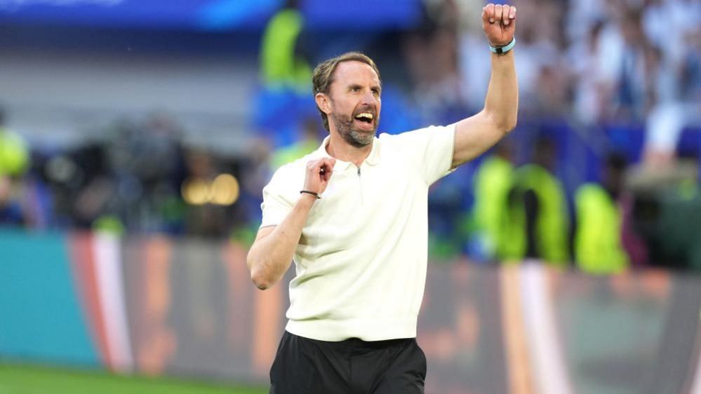 Gareth Southgate celebrates after England's win over Switzerland on 6 July 2024