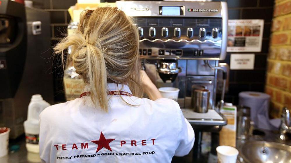 Pret a Manger worker making a coffee 