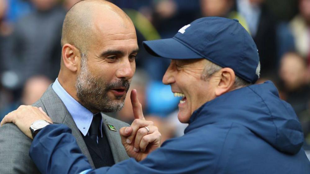 Pep Guardiola (left) and Tony Pulis, pictured laughing with each other when Manchester City played Pulis's West Brom team in May 2017