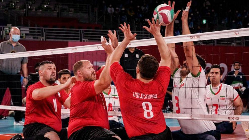 Action from the men's sitting volleyball final between Iran and Russia at the Tokyo Paralympics