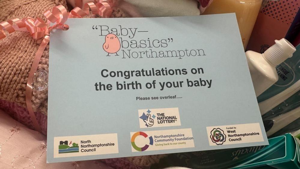 Grey card which says "congratulations on the birth of your baby"