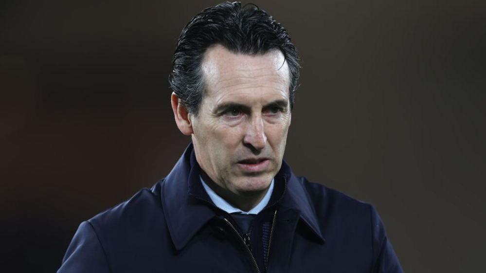 Unai Emery looks on after Aston Villa's loss to Monaco