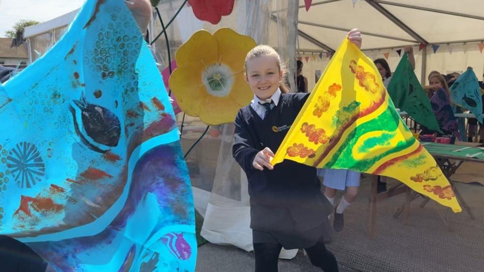 Children making flags at for the Out There Festival