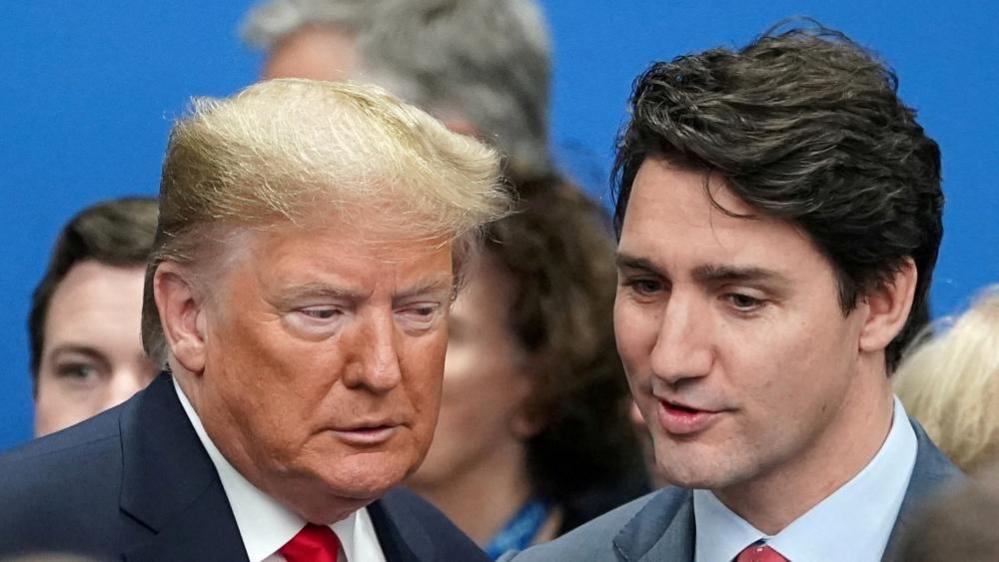 U.S. President Donald Trump talks with Canada's Prime Minister Justin Trudeau during a North Atlantic Treaty Organization Plenary Session at the NATO summit in Watford, Britain, December 4, 2019.