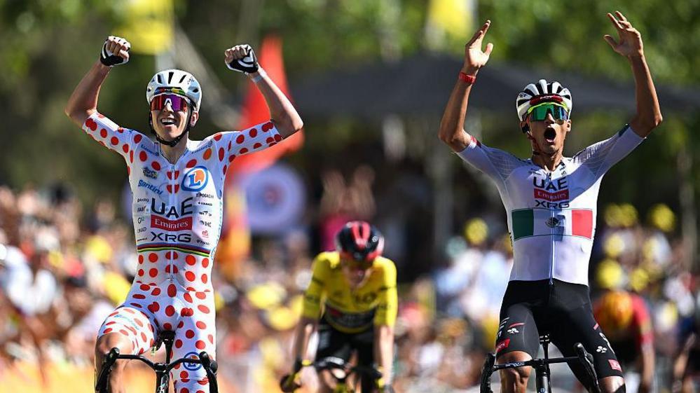 Isaac del Toro (right) & Tadej Pogacar left celebrate