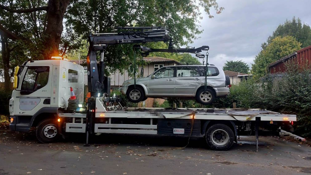 Car being lifted onto a tow truck