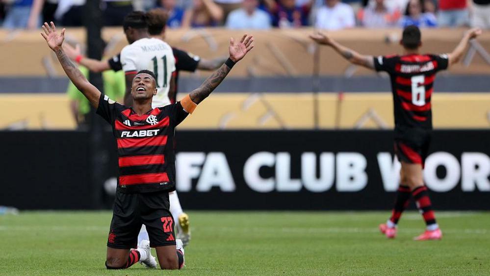 Bruno Henrique falls to his knees after the full time whistle against Chelsea in their Club World Cup group game