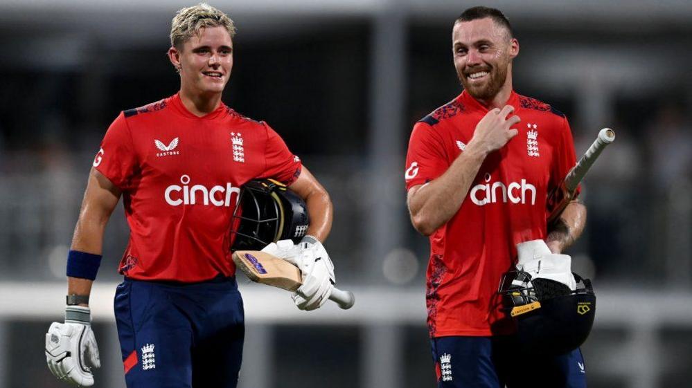 England batter Jacob Bethell (left) and Phil Salt (right) smile as they walk off after beating West Indies