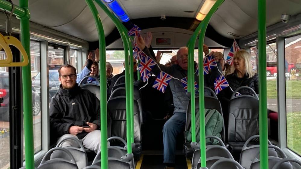 Passengers sitting on a bus