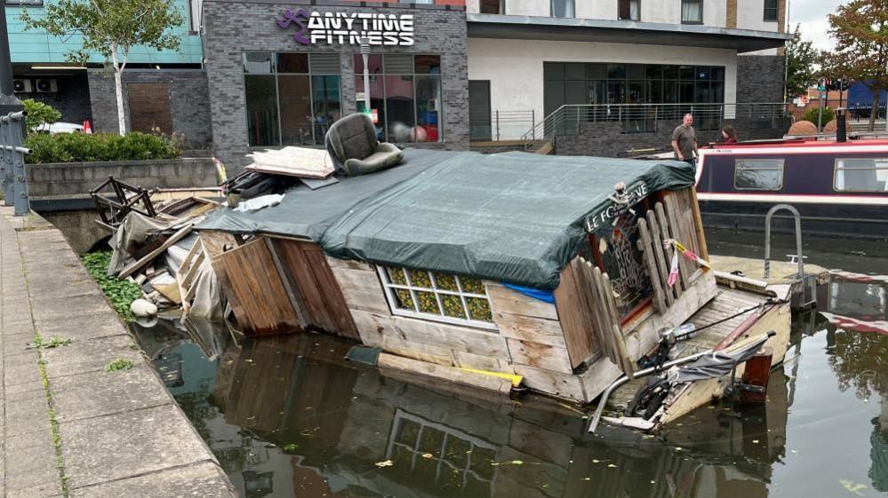 A rear view of the abandoned boat in Loughborough Basin.