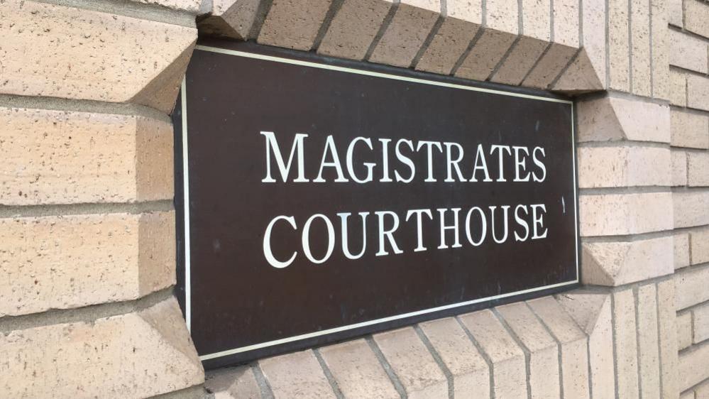 Great Yarmouth Magistrates' Court house, a yellow brick building with a bevelled recess for a plaque that reads: "Magistrates Courthouse"