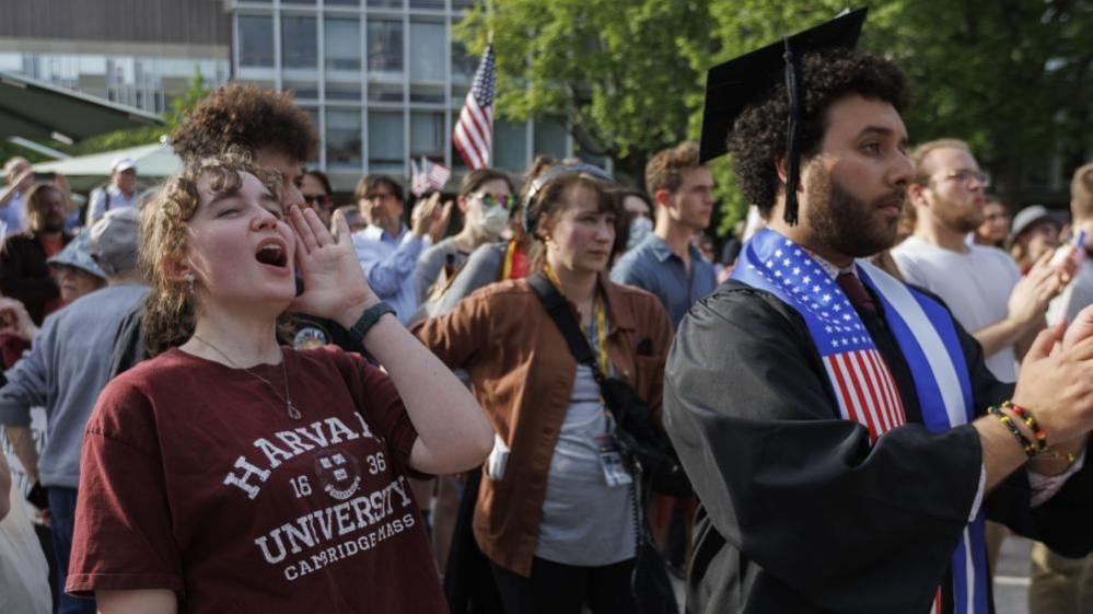 Harvard University students chant with fellow students