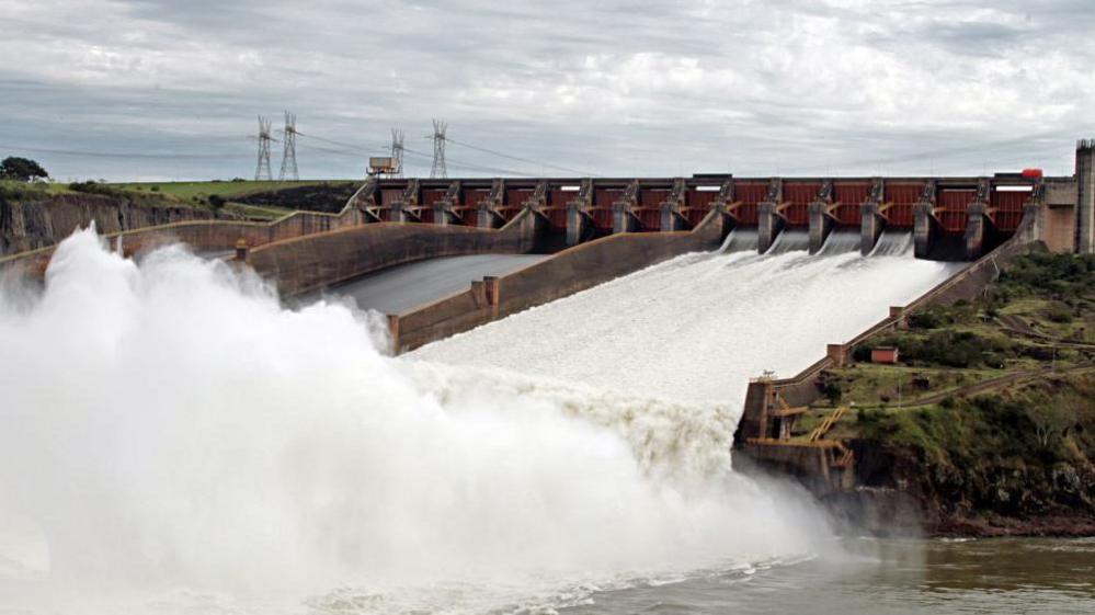 Water gushing out of the giant Itaipu Dam on the Paraná River between Paraguay and Brazil